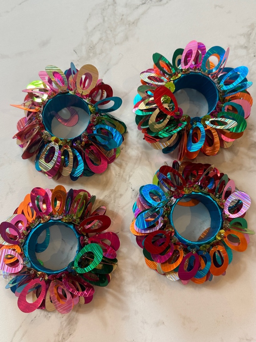 4 napkin rings beaded. Pier 1 imports. Fiesta holiday